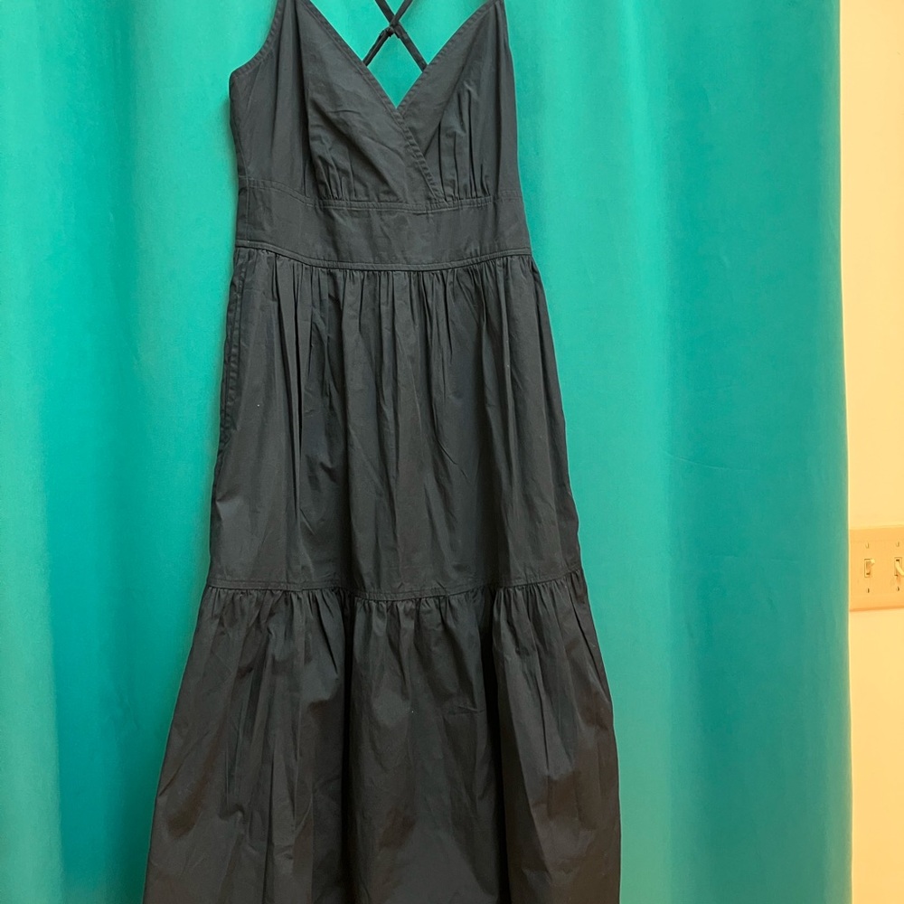 Size small navy blue spaghetti  crisscross strap dress. Never worn.